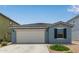 Charming single-Gathering home with a tile roof, two-car garage, and desert landscaping at 36463 W San Alvarez Ave, Maricopa, AZ 85138