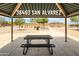 Covered picnic area with tables and benches, perfect for gatherings at 36463 W San Alvarez Ave, Maricopa, AZ 85138