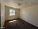 Empty bedroom with carpet and a window at 3719 W Thunderbird Rd, Phoenix, AZ 85053