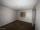 Bedroom with carpet, closet, and a boarded window at 3719 W Thunderbird Rd, Phoenix, AZ 85053