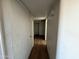 Hallway featuring wood floors and a closet at 3719 W Thunderbird Rd, Phoenix, AZ 85053