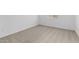 Simple bedroom featuring neutral carpeting, a window, and ample natural light at 37627 W Padilla St, Maricopa, AZ 85138