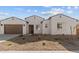 Charming single story home showing front elevation, garage and low maintenance desert landscaping at 37627 W Padilla St, Maricopa, AZ 85138