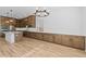 Spacious kitchen featuring ample counter space, stainless steel appliances, and modern lighting at 37627 W Padilla St, Maricopa, AZ 85138