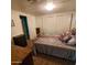 Bedroom with neutral walls, carpeted floors, and a dresser at 4065 E University Dr # 240, Mesa, AZ 85205