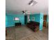 Spacious living room showcasing wood laminate flooring, ceiling fan, and a cozy atmosphere at 4065 E University Dr # 240, Mesa, AZ 85205
