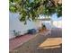 Outdoor patio with table, chairs, grill, and AC, perfect for entertaining at 4065 E University Dr # 240, Mesa, AZ 85205