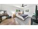 Modern bedroom with sleek furniture, a ceiling fan, and ample natural light at 4208 N Parkway Ave, Scottsdale, AZ 85251
