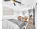 Bright bedroom showcasing cozy seating, modern accents, and a ceiling fan at 4208 N Parkway Ave, Scottsdale, AZ 85251
