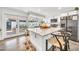 Open kitchen view with a large island, stainless steel appliances, and sliding doors at 4208 N Parkway Ave, Scottsdale, AZ 85251