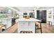 Stylish kitchen featuring a large island, stainless steel appliances, and white cabinets at 4208 N Parkway Ave, Scottsdale, AZ 85251