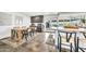 Bright eat-in kitchen area with modern table, chairs, and polished concrete floors at 4208 N Parkway Ave, Scottsdale, AZ 85251