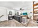 Bright living room with a large gray sofa, modern decor, and natural light at 4208 N Parkway Ave, Scottsdale, AZ 85251