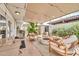 Inviting outdoor patio featuring a fire pit, grill, and comfortable seating area at 4208 N Parkway Ave, Scottsdale, AZ 85251