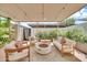 Outdoor patio with stylish seating around a modern fire pit, perfect for entertaining at 4208 N Parkway Ave, Scottsdale, AZ 85251