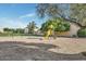 Community playground with slide, swing, and sand ground located near apartment complex at 4208 N Parkway Ave, Scottsdale, AZ 85251