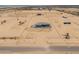Expansive aerial view of a modern home with a vast, desert landscape at 43481 W Carefree Pl, Maricopa, AZ 85138