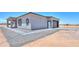 Corner view of a house showcasing modern design and outdoor space at 43481 W Carefree Pl, Maricopa, AZ 85138