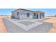 View of modern home design with desert landscape and paved walkways at 43481 W Carefree Pl, Maricopa, AZ 85138