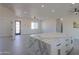Spacious open floor plan with kitchen island and ample space for living and dining at 43481 W Carefree Pl, Maricopa, AZ 85138