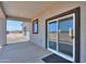 Covered patio with sliding glass doors and desert views at 43481 W Carefree Pl, Maricopa, AZ 85138
