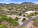 Wide aerial view of the desert property surrounded by the community at 4684 E Coachwhip Rd, Cave Creek, AZ 85331