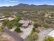 Remote desert home with circular driveway and desert landscape at 4684 E Coachwhip Rd, Cave Creek, AZ 85331