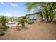 Exterior backyard view with desert landscaping, pool, and covered patio area at 4684 E Coachwhip Rd, Cave Creek, AZ 85331