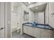 Bright bathroom featuring dual sinks, a large mirror, and a shower-tub combo at 4684 E Coachwhip Rd, Cave Creek, AZ 85331