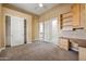 Spacious bedroom with closet, built-in desk, and ceiling fan at 4684 E Coachwhip Rd, Cave Creek, AZ 85331