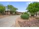 Charming single-story home with mature trees and a well-manicured circular driveway at 4684 E Coachwhip Rd, Cave Creek, AZ 85331