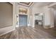 Bright foyer with hardwood flooring and a view of the home office at 4684 E Coachwhip Rd, Cave Creek, AZ 85331