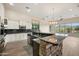 Modern kitchen with granite countertops, custom cabinets, and stainless steel appliances, ideal for entertaining at 4684 E Coachwhip Rd, Cave Creek, AZ 85331