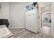 Functional laundry room with ample storage cabinets, a sink, and easy access to other rooms at 4684 E Coachwhip Rd, Cave Creek, AZ 85331