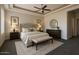 Serene main bedroom with a tray ceiling, ceiling fan, and neutral decor at 4684 E Coachwhip Rd, Cave Creek, AZ 85331