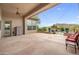 Covered patio with pavers, ceiling fan, backyard views, and easy access to pool at 4684 E Coachwhip Rd, Cave Creek, AZ 85331