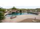 Inviting swimming pool with rock waterfall, lush landscaping, and a serene outdoor oasis at 4684 E Coachwhip Rd, Cave Creek, AZ 85331
