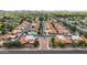 An aerial view of a residential community with lush greenery and a sparkling pool at 5509 E Desert Hills Dr, Scottsdale, AZ 85254