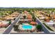 Aerial view of community pool with cabana, hot tub, lounge chairs, and mature landscaping at 5509 E Desert Hills Dr, Scottsdale, AZ 85254