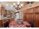 Open kitchen and dining area with wood cabinets and a view of the kitchen appliances at 5509 E Desert Hills Dr, Scottsdale, AZ 85254