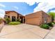 Beautiful single-story home with a red tile roof, desert landscaping, and a two-car garage at 5509 E Desert Hills Dr, Scottsdale, AZ 85254