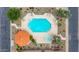 Aerial view of a community pool with lounge chairs, landscaping, cabana and hot tub at 5509 E Desert Hills Dr, Scottsdale, AZ 85254