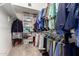 Walk-in closet with ample shelving and hanging space for organized storage at 5509 E Desert Hills Dr, Scottsdale, AZ 85254