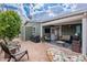 Charming back patio with brick flooring, grill, and comfortable seating arrangements at 650 N Hawes Rd # 4128, Mesa, AZ 85207