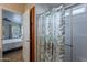Bathroom showcasing the walk-in shower with glass door and light leaf patterned shower curtain at 650 N Hawes Rd # 4128, Mesa, AZ 85207