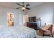 Bright bedroom features a ceiling fan and easy access to the ensuite bathroom at 650 N Hawes Rd # 4128, Mesa, AZ 85207