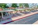 An inviting community BBQ area with multiple grills and shaded seating perfect for outdoor gatherings and summer cookouts at 650 N Hawes Rd # 4128, Mesa, AZ 85207