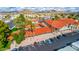 Aerial view of a sparkling community pool, surrounded by palm trees and a well-manicured landscape, a true oasis at 650 N Hawes Rd # 4128, Mesa, AZ 85207