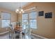Inviting dining room featuring a stylish table and chairs, natural light, and elegant decor at 650 N Hawes Rd # 4128, Mesa, AZ 85207