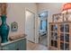 Hallway featuring tile floors, doors to rooms, and decor at 650 N Hawes Rd # 4128, Mesa, AZ 85207